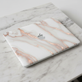 MacBook with marble texture skin design